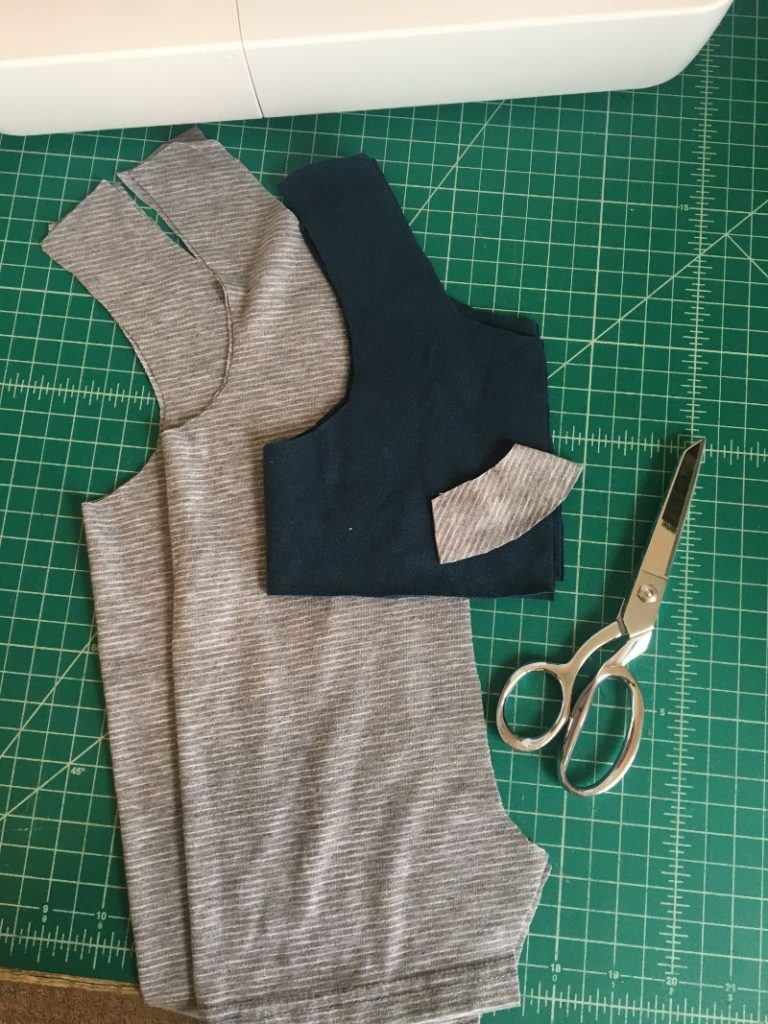 free baby romper pattern pieces cut out of fabric