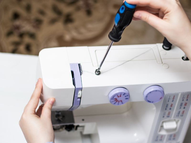 Repair sewing machine with screwdriver