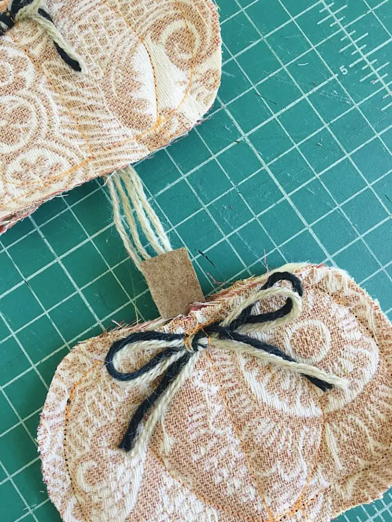 sew bows to the top of the pumpkin