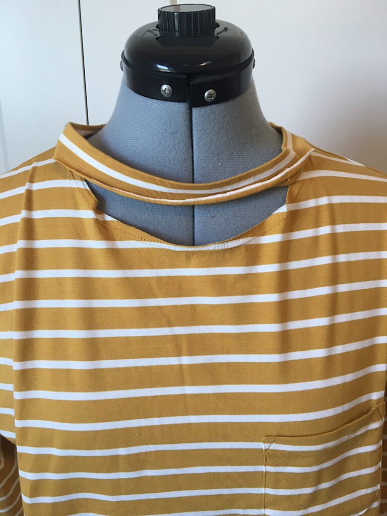 Neckband detached from T Shirt