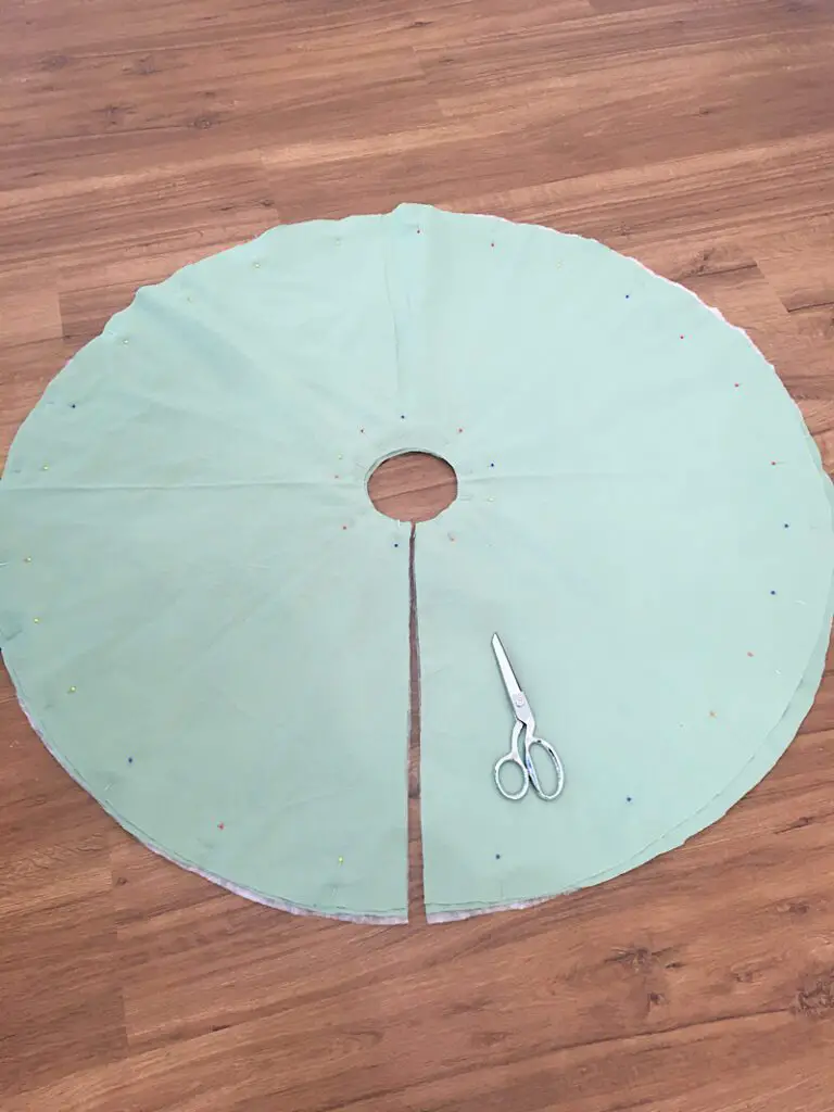 cut a slit in the bedsheet to make it a tree skirt