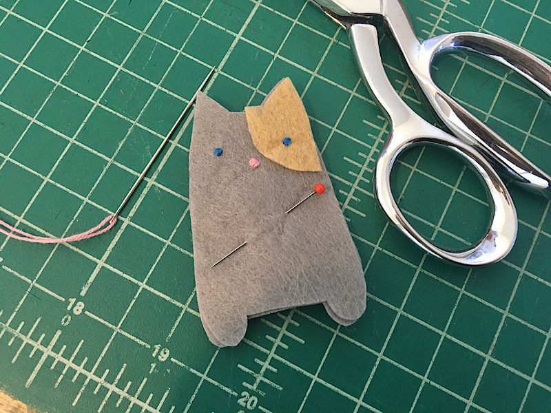 pieces of cat finger puppet pinned together