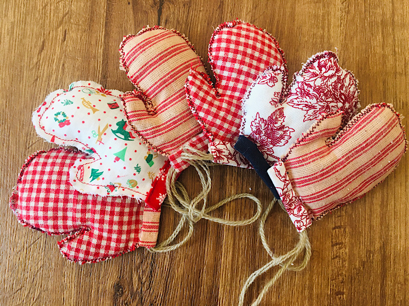 a set of mitten christmas ornaments