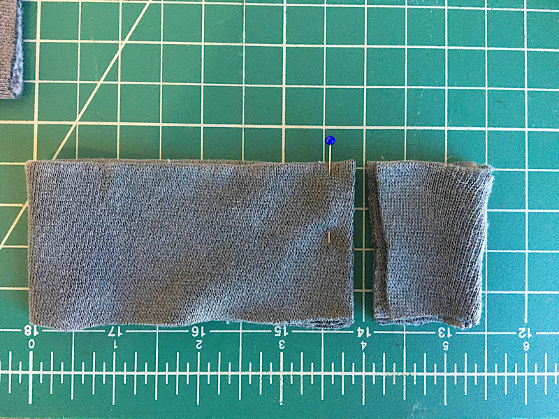 cutting excess off of sleeve cuff to tighten it