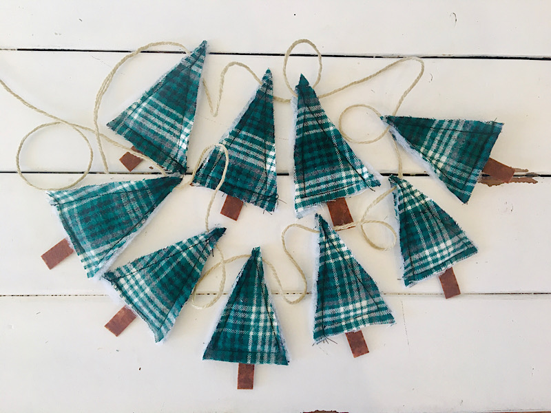 plaid green Christmas tree bunting sewing pattern on a white table