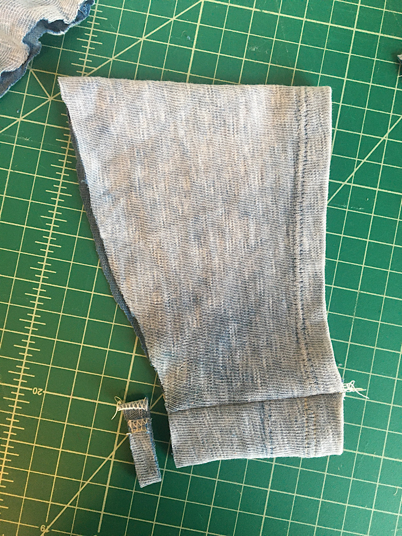 trimming away fabric from sleeve