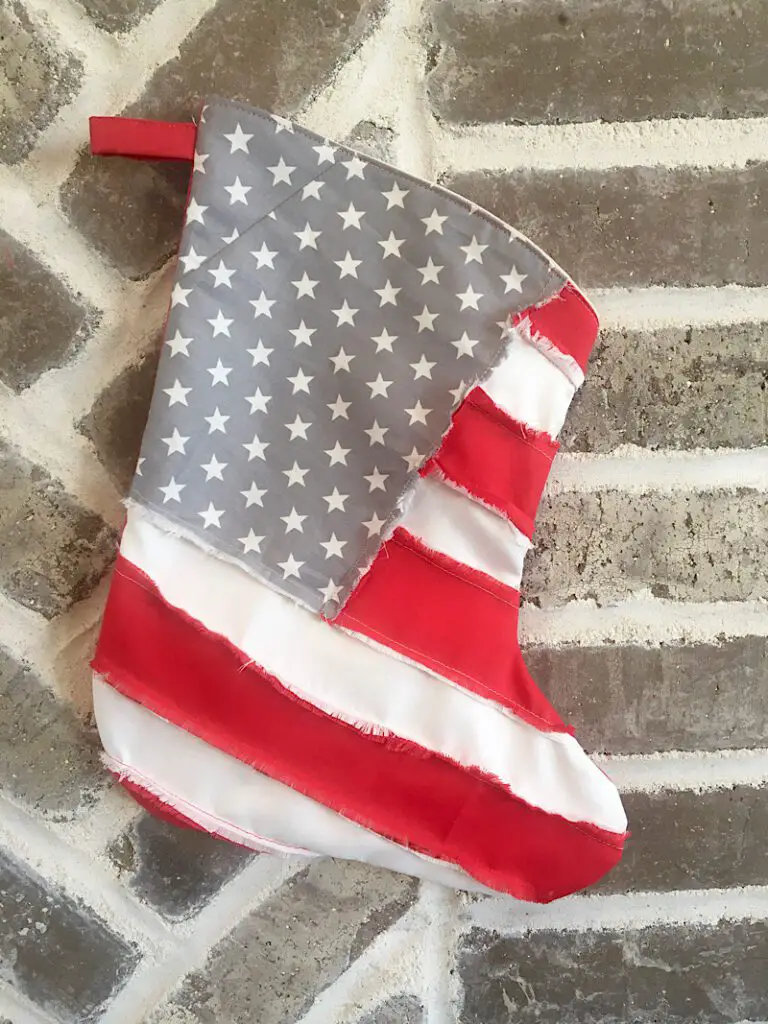 DIY American Flag Patriotic Christmas Stocking Hanging On Brick