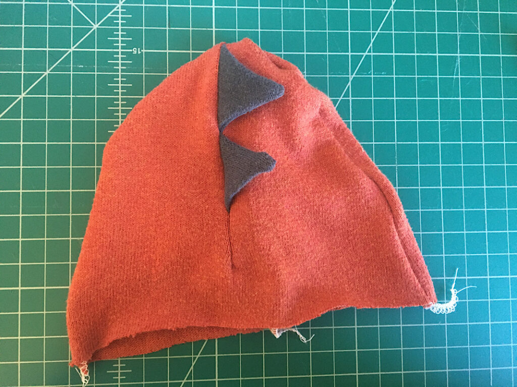 dinosaur hat sewn together