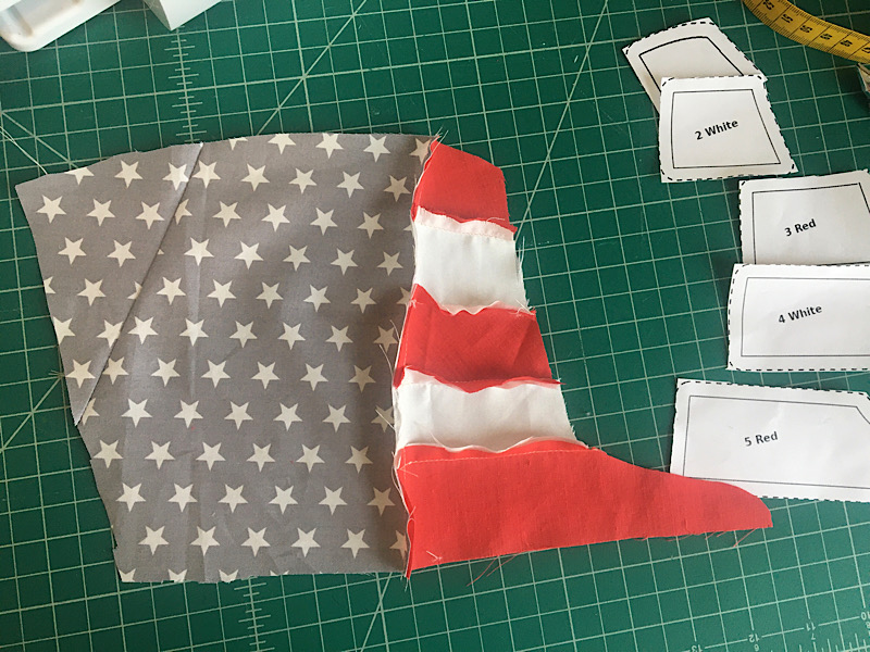 Sewing the stars block to the flag stripes