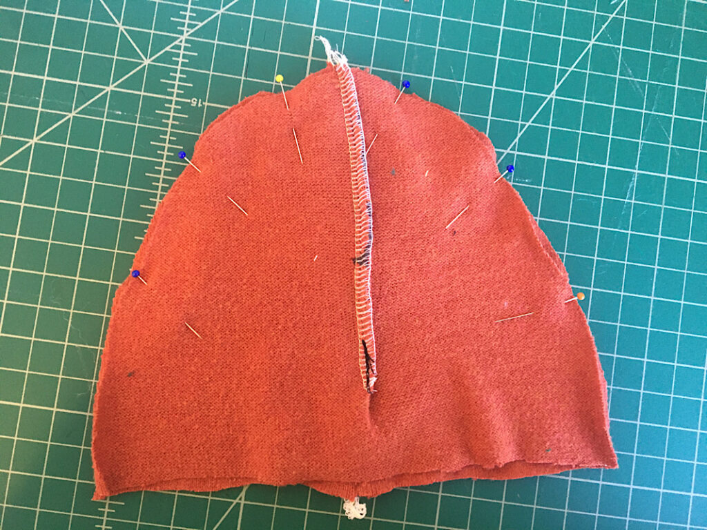 dino beanie pieces pinned together