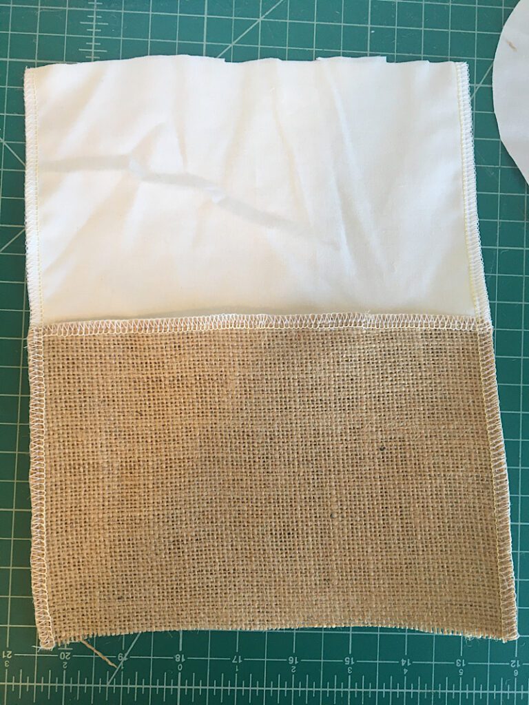 sewing down the sides of the burlap planter basket 