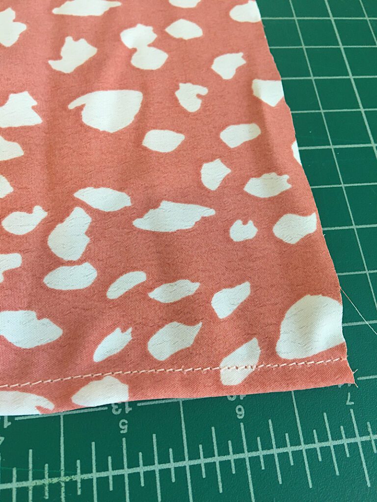 Pre hem the scrap fabric to match the sleeve