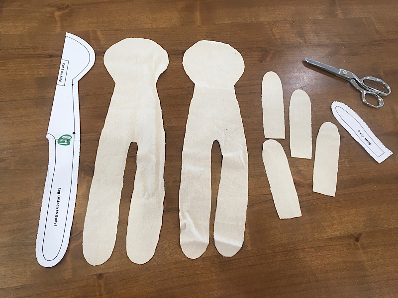 cloth doll body pattern pieces cut out and lined up