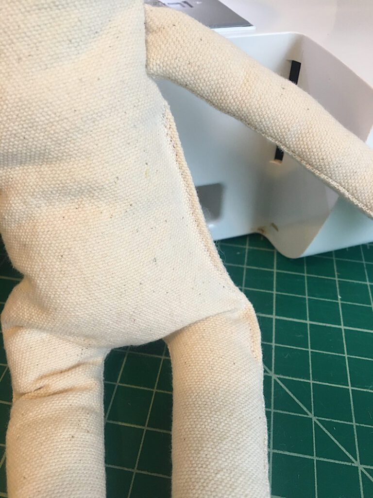 sew the opening closed on the doll with a machine stitch