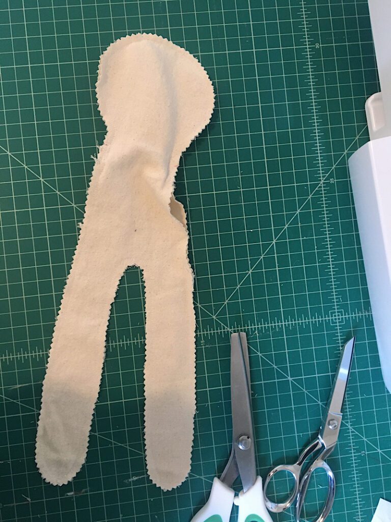 sewing around the cloth doll body