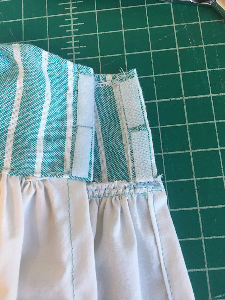 hook and loop sewn to bodice