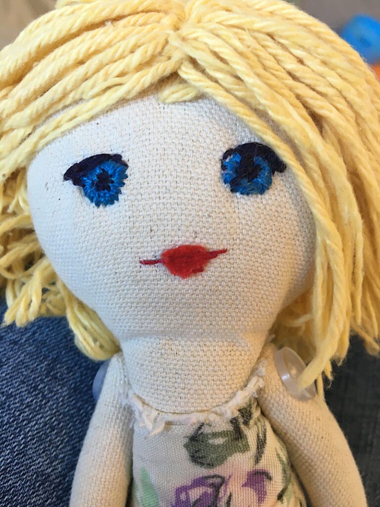 cloth doll with embroidered lips