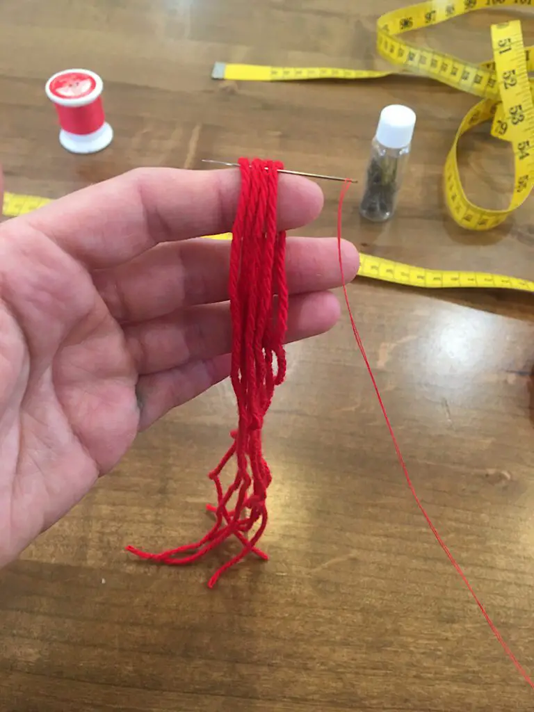 hold yarn over finger to insert needle