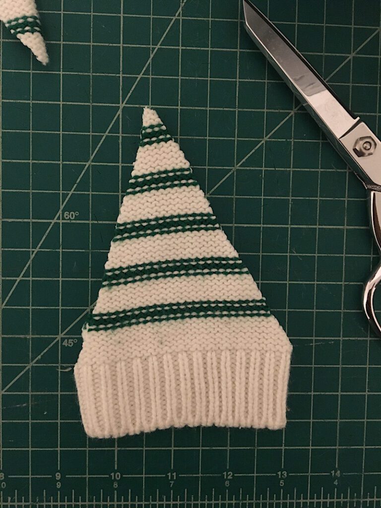 cut out triangles from sweater for the gnomes hat