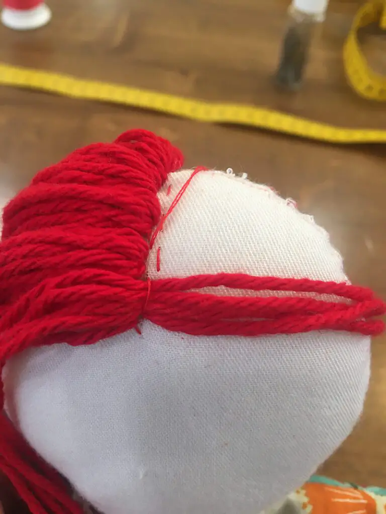 sewing the right side of the yarn  doll hair