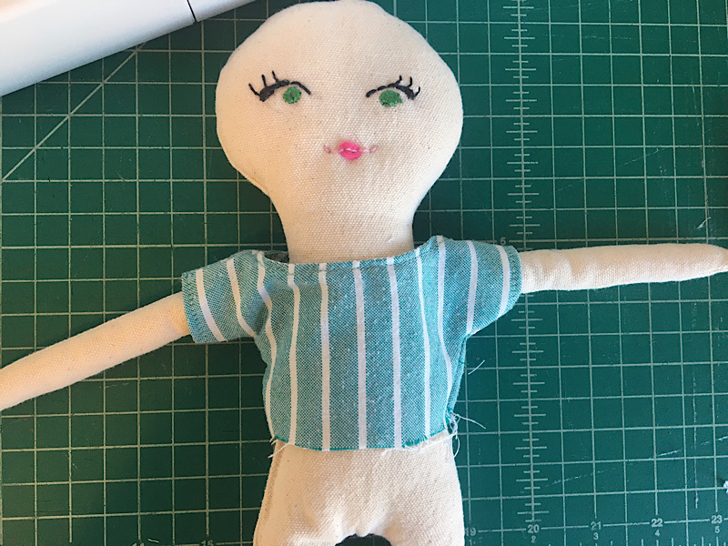 trying the rag doll bodice on the doll to fit