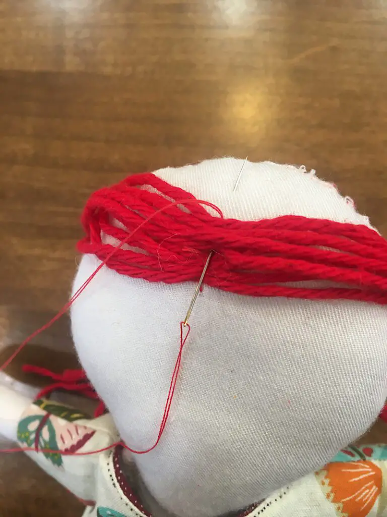 backstitiching yarn for a rag doll