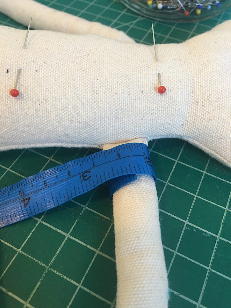 measuring the fabric dolls arms