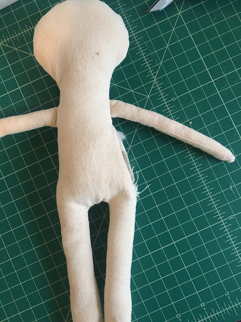 stuffing the doll with fiberfill