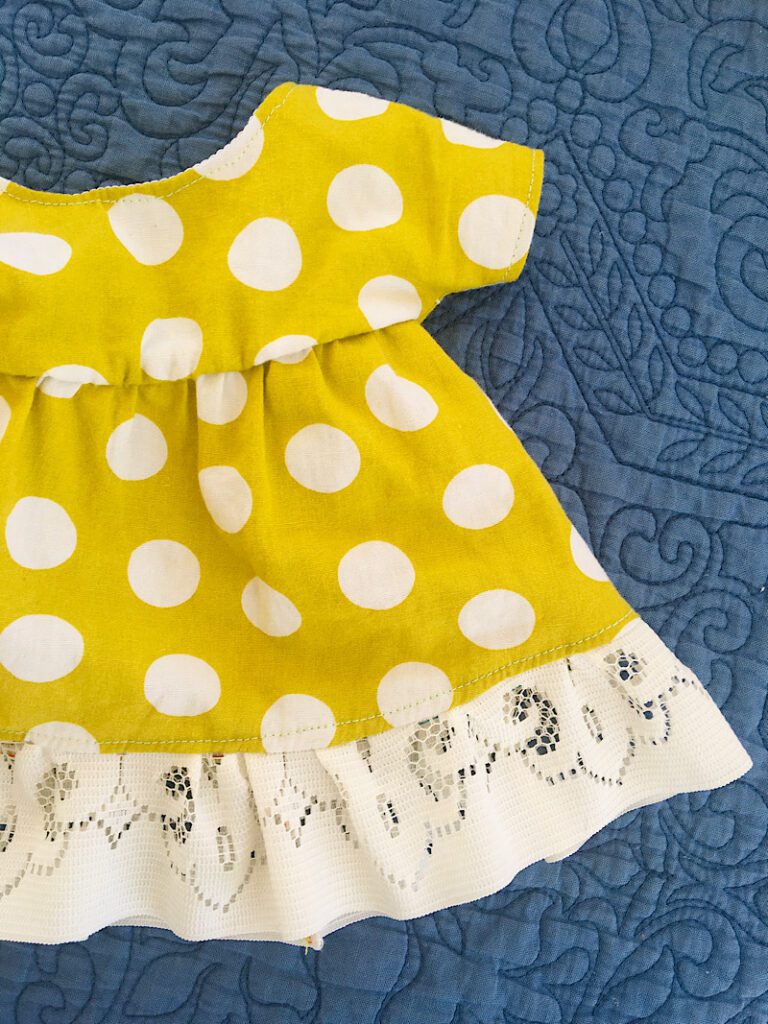 polka dot yellow rag doll dress with lace trim
