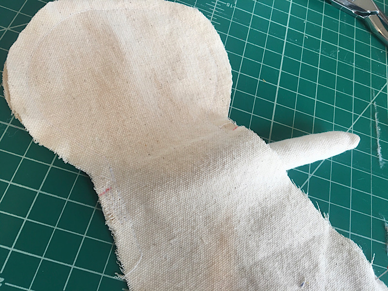 sew the left arm to the doll's body