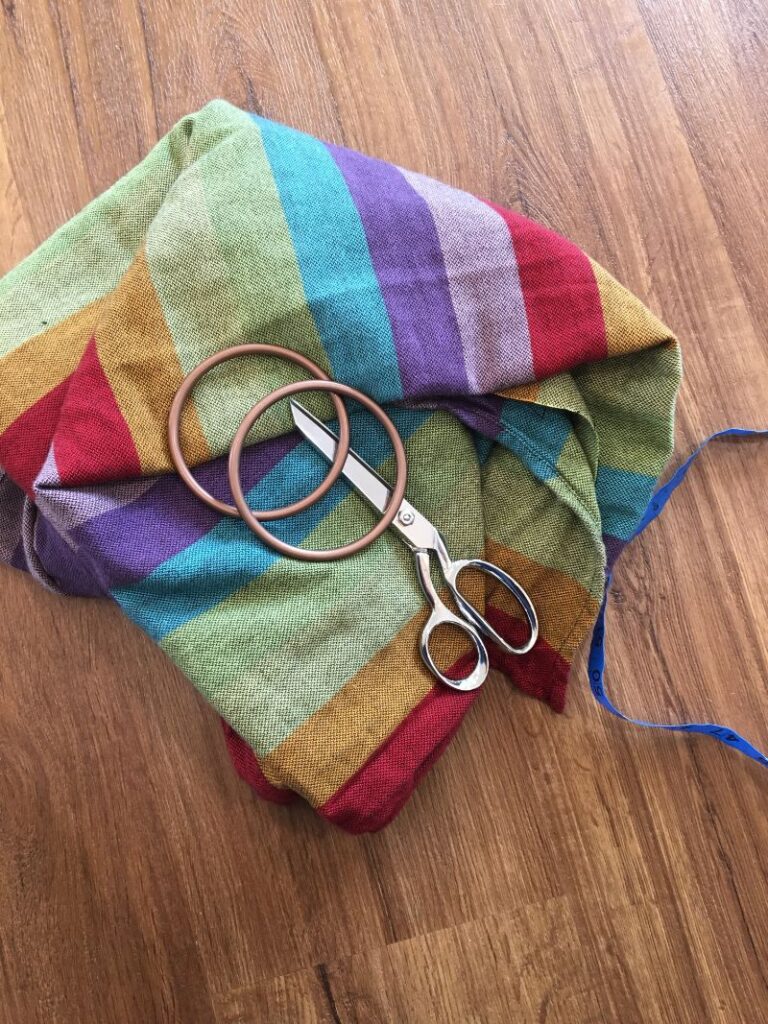 DIY ring sling supplies, rings, scissors, woven wrap, measuring tape