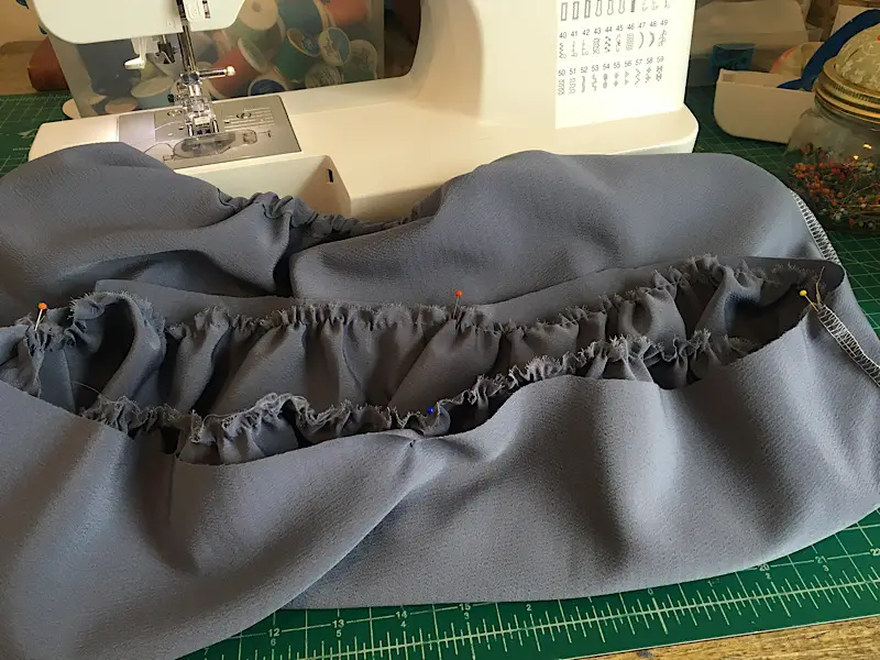 pin the gathered skirt to the bodice of the peasant dress