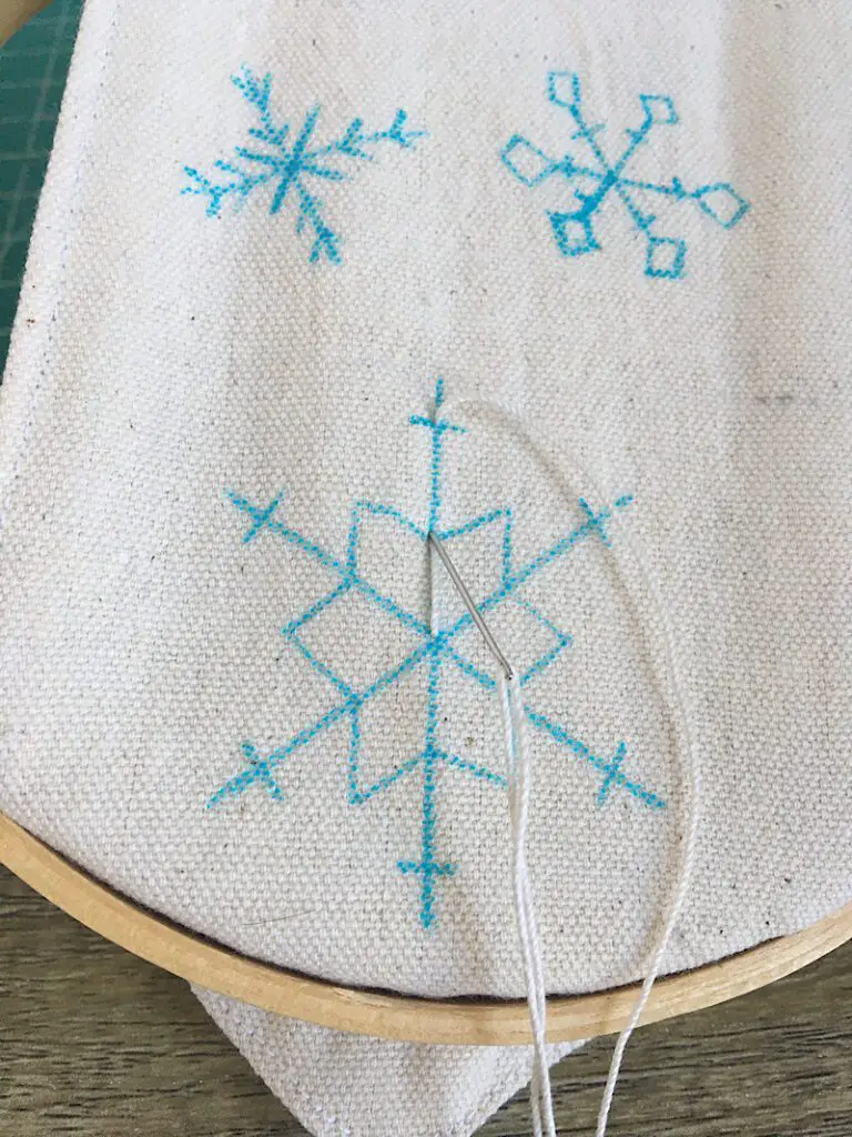 embroidering a snowflake