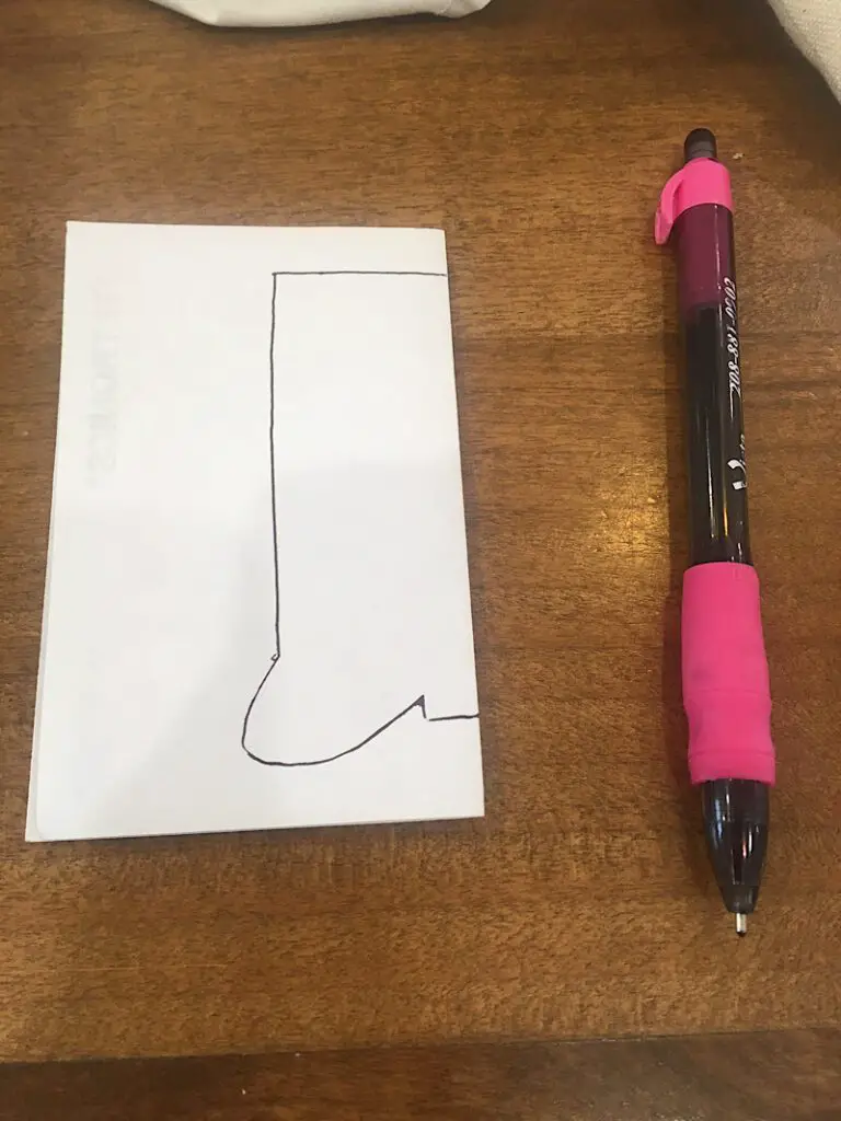 Folded paper with boot pattern
