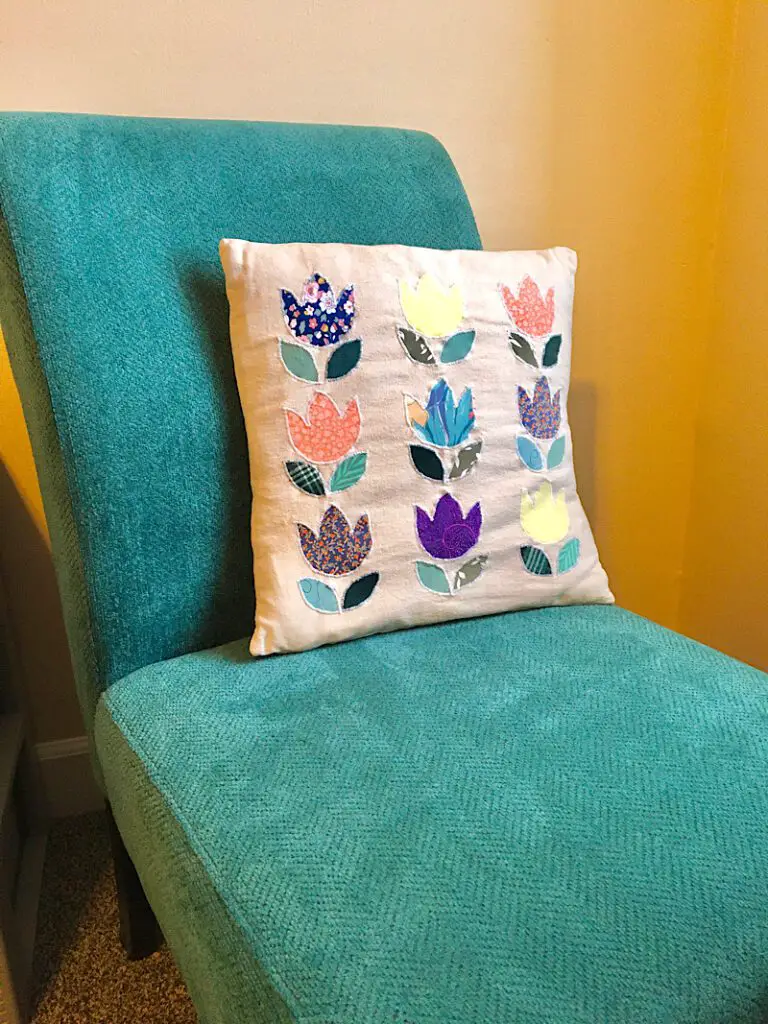 midcentury modern spring tulip pillow cover on green chair