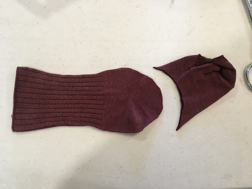 cutting a sock into a fish shape