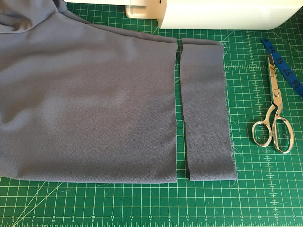 cutting off excess length of dress bodice