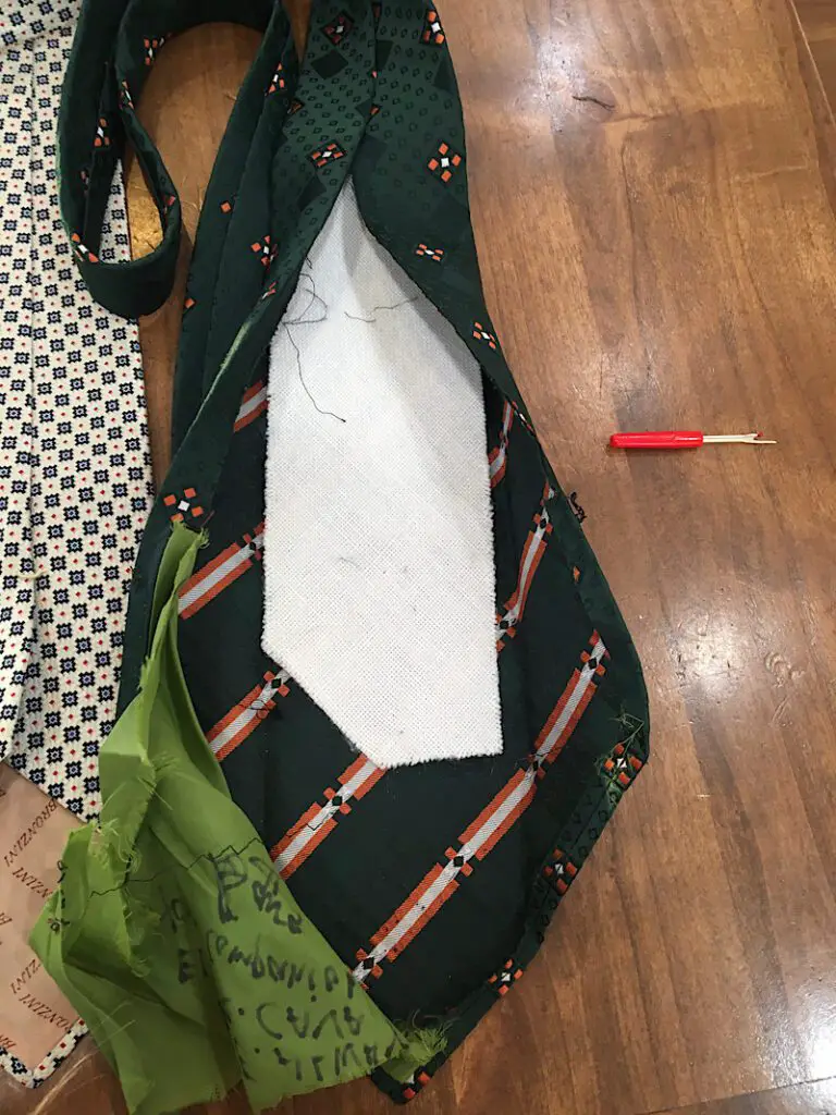 Open up tie and remove lining