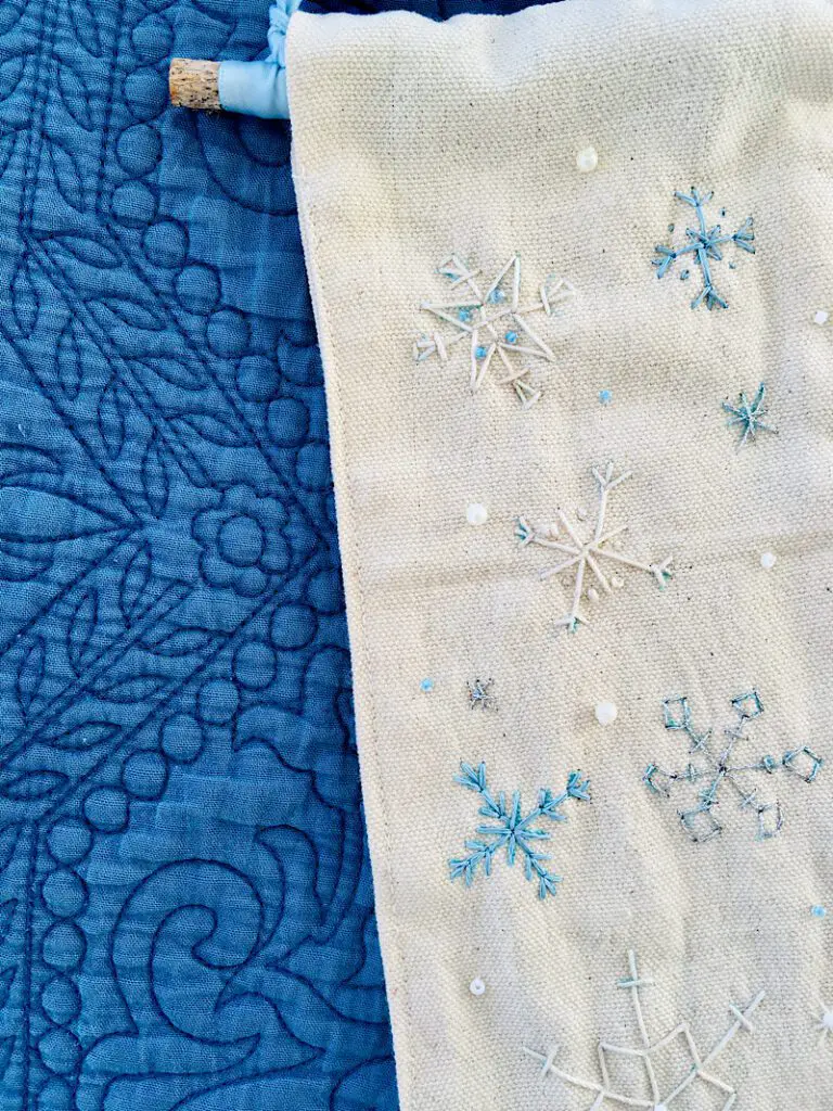 closeup of embroidered snowflake door hanger