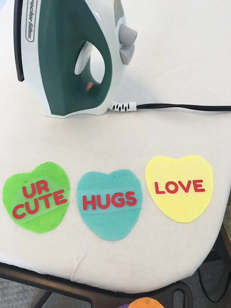 ironing on vinyl words to felt conversation hearts