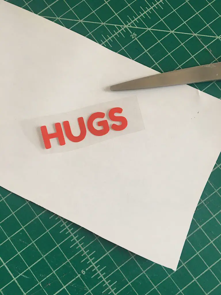 vinyl word "hugs" cut out