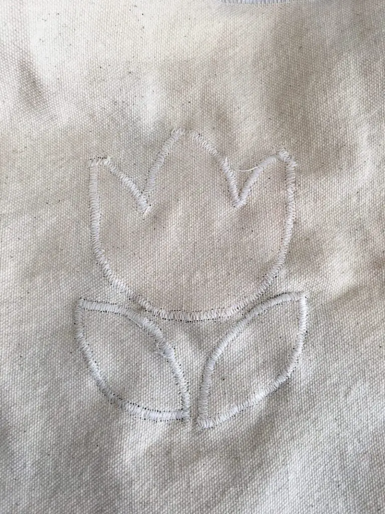 tulip applique on back of a pillow cover