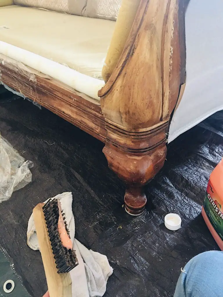 wire brush removing stain on couch leg