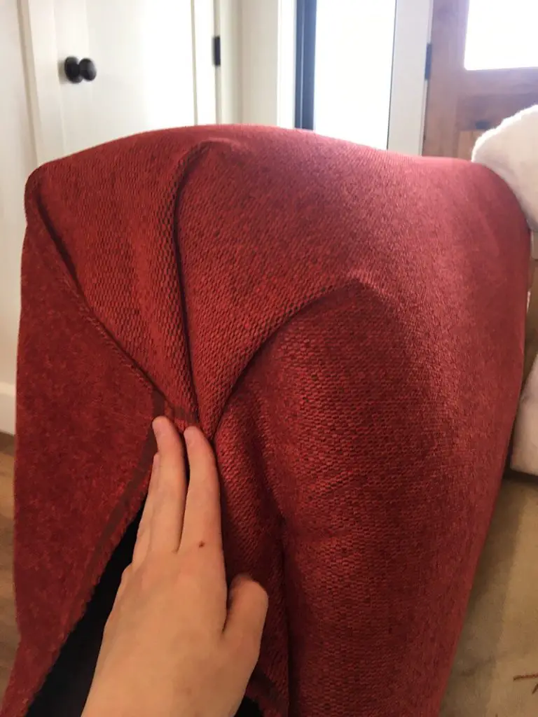 folding fabric over arm of couch