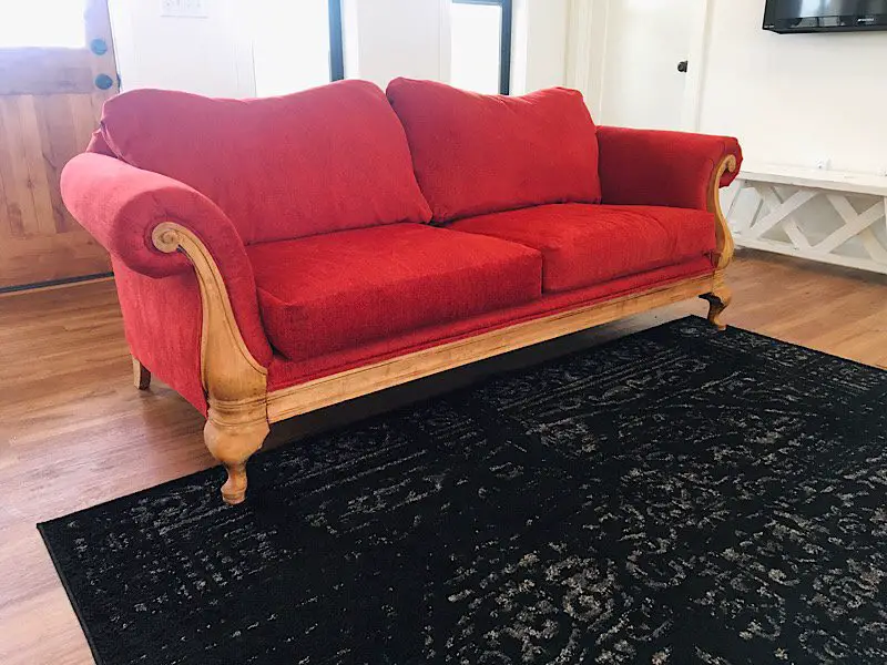 completed reupholstered sofa red fabric