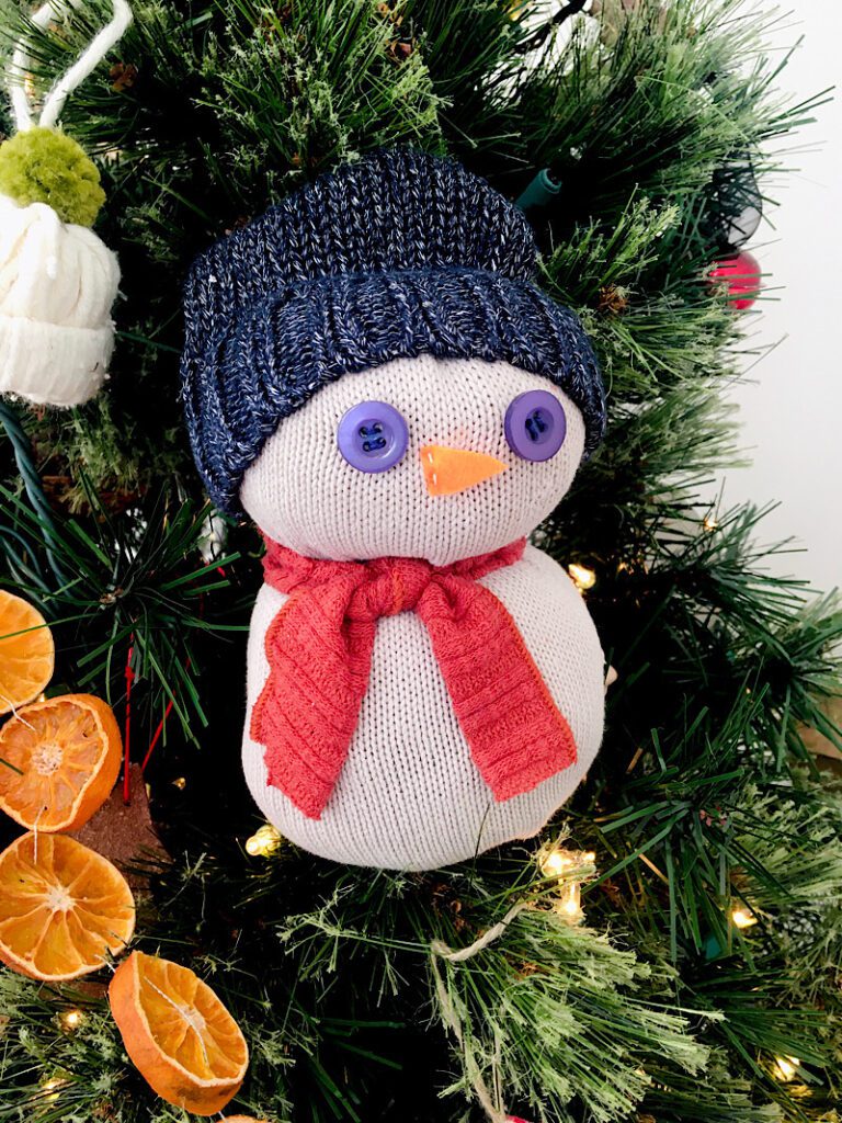sweater snowman in christmas tree