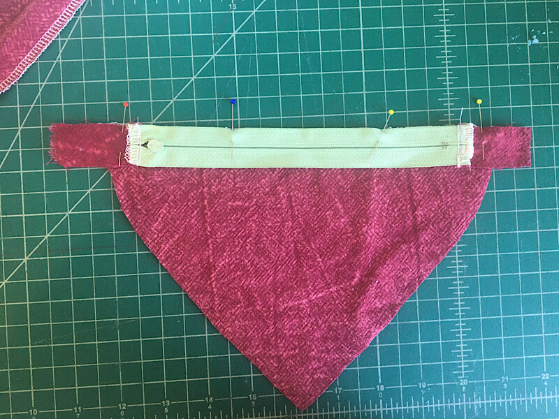 sewing the zipper to the bottom of the heart purse 