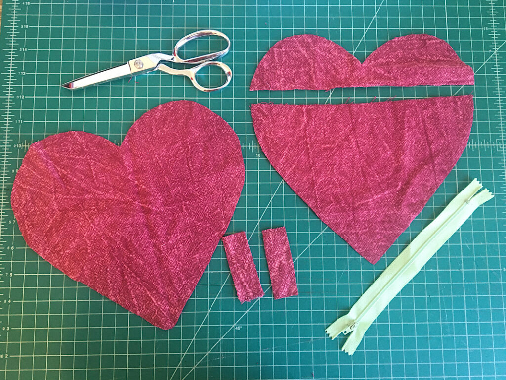 Heart wallet pattern pieces cut out on table