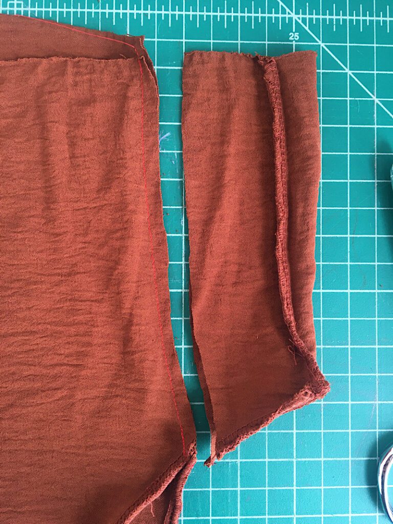 trim the excess fabric away from the dress seam