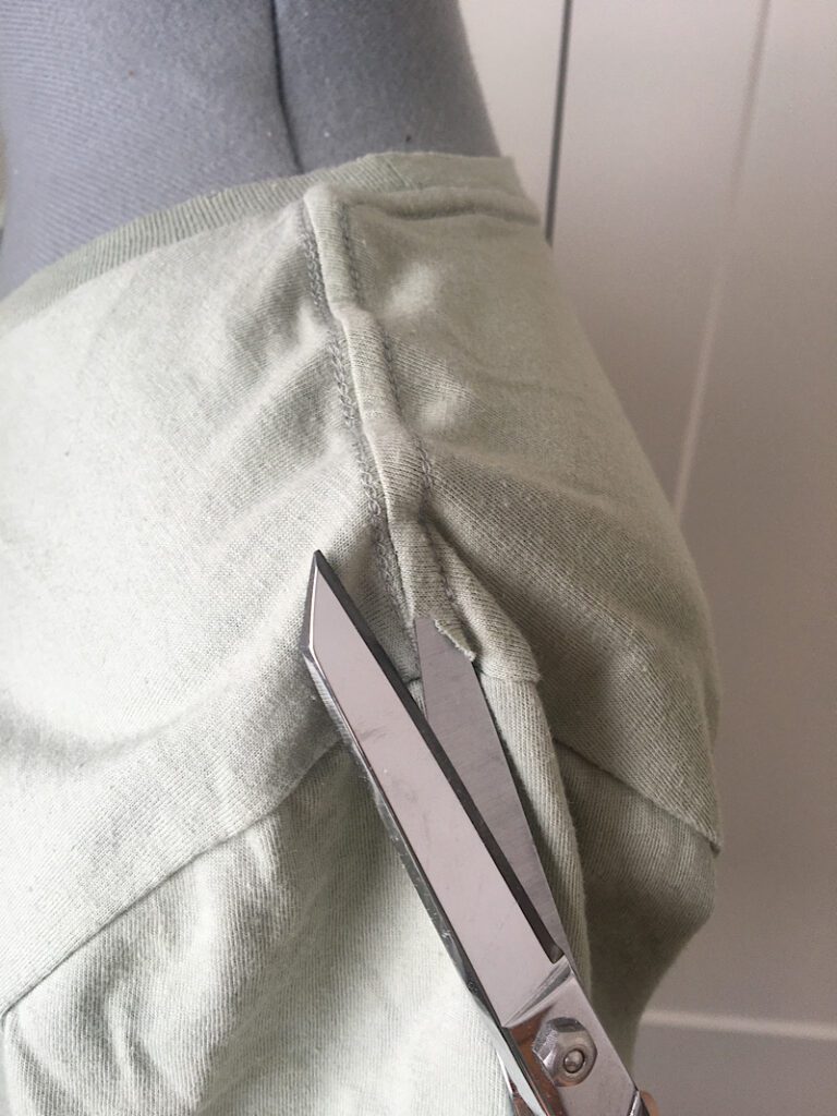 cutting the coverstitch on a shoulder